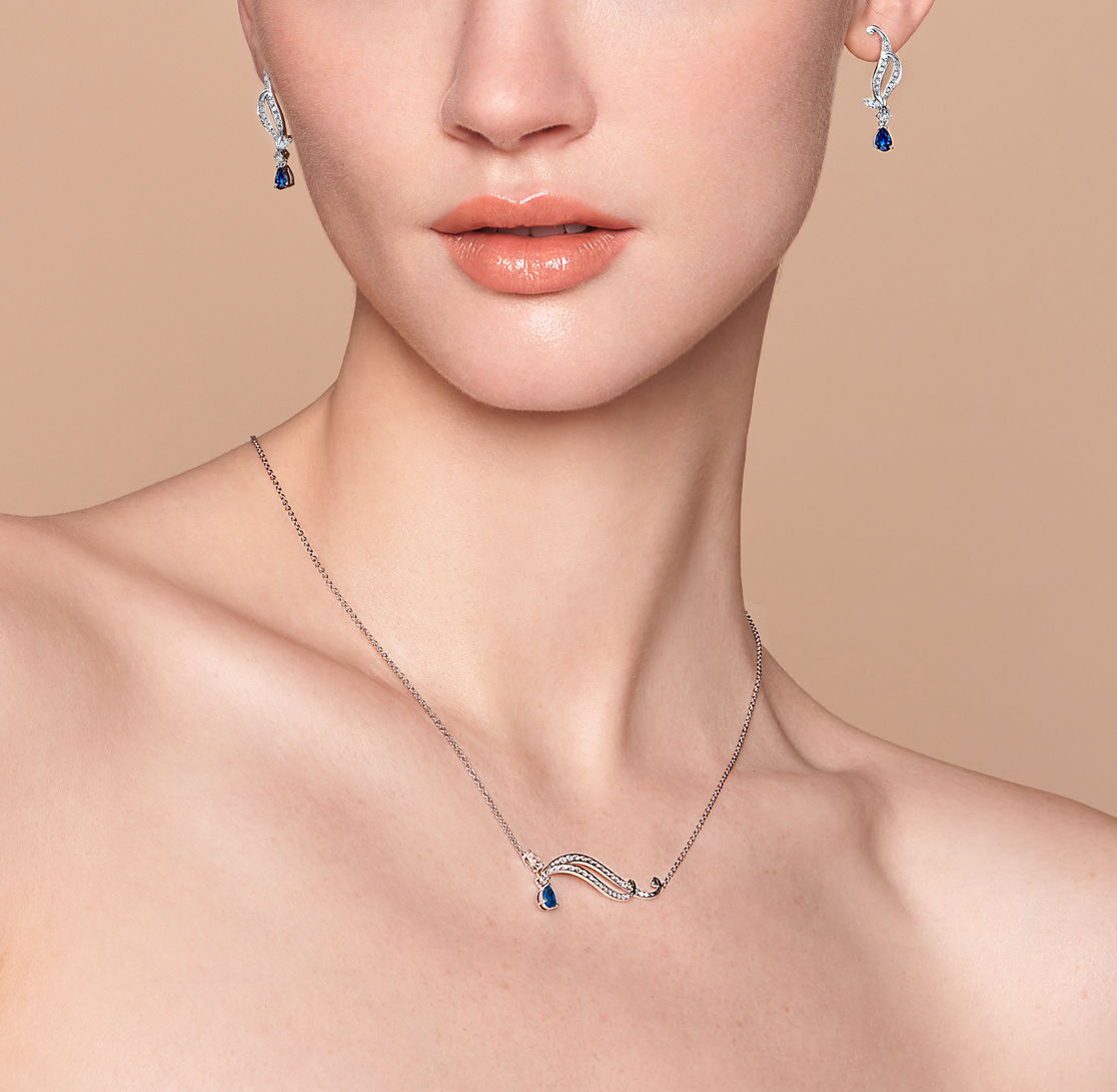 9ct White Gold Created Ceylon Sapphire & Diamond Pendant in Blue | Prouds